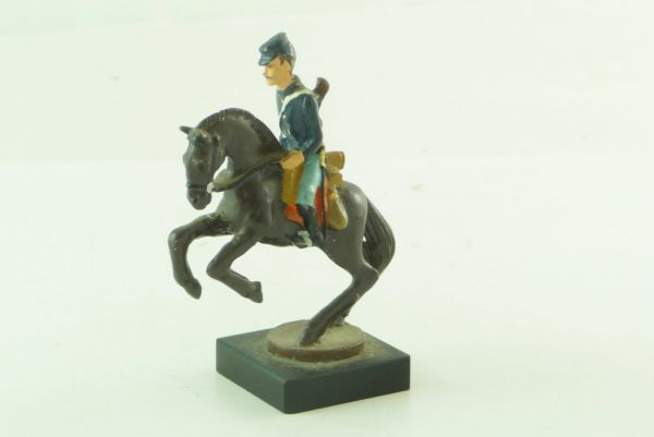 Civil War figure of metal; Union Army soldier riding with rifle