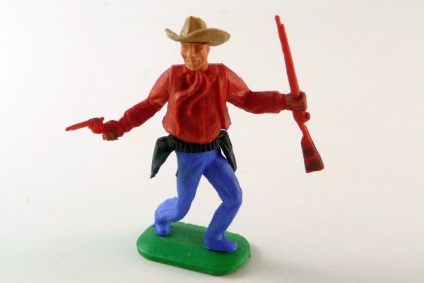 Timpo Toys Cowboy 1st version standing with pistol and rifle, red