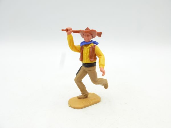 Timpo Toys Cowboy 2nd version walking, striking with rifle