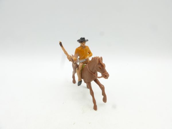 Jackson Cowboy riding, rifle put down sideways - see photo