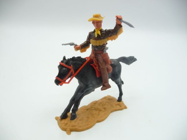 Timpo Toys Cowboy 4. Version reitend mit Messer + Pistole + weitere Waffe im Gurt