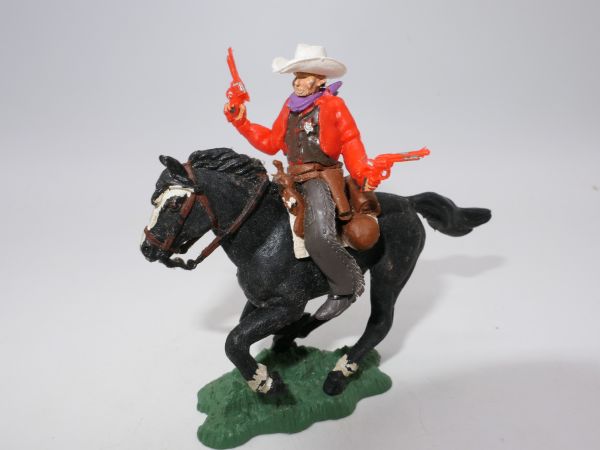 Britains Swoppets Cowboy / Sheriff riding and shooting wildly with 2 pistols