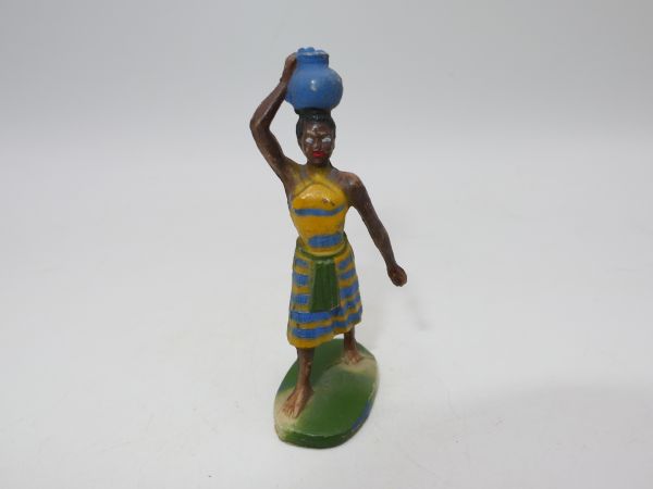 Clairet African woman balancing with jug