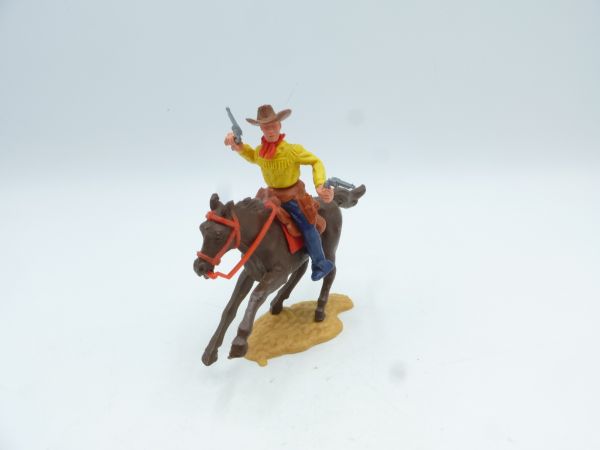 Timpo Toys Cowboy 2. Version reitend mit 2 Pistolen wild schießend