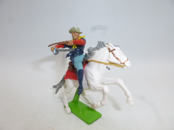 Britains Deetail Soldier 7th Cavalry on horseback, firing rifle over sabre