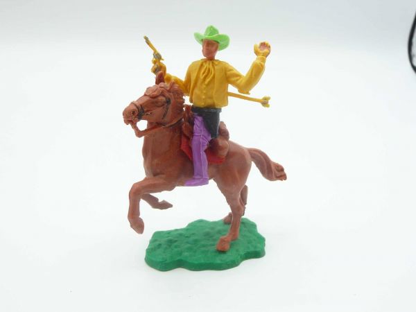 Timpo Toys Cowboy 1. Version (kleiner Hut) reitend, von Pfeil getroffen