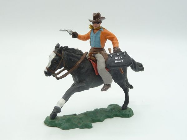 Britains Swoppets Cowboy riding, bank robber with moneybag + pistol, orange jacket
