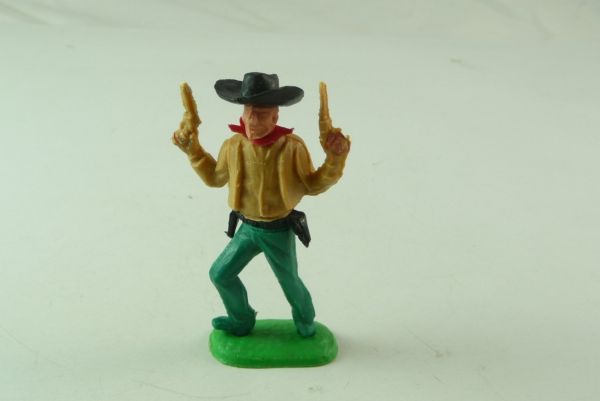 Charbens Cowboy stehend, mit 2 Pistolen nach oben schießend