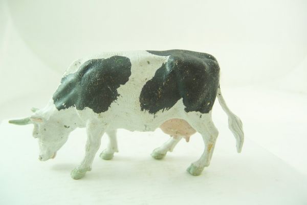 Britains Cow grazing, black/white