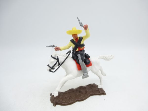 Timpo Toys Mexican on horseback, yellow, firing 2 pistols wildly