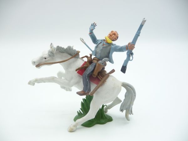 Britains Swoppets Cowboy riding with rifle, hit by arrow, jacket light blue