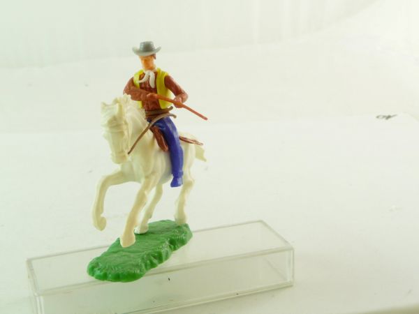 Elastolin Cowboy riding, holding rifle at side, with pistol