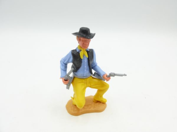 Timpo Toys Cowboy 3. Version hockend mit 2 Pistolen - schöne Farbkombi