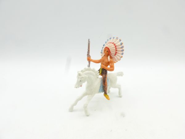 Jackson Indian riding, rifle sideways - see photo