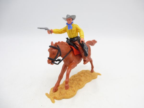 Timpo Toys Cowboy 2. Version reitend mit Geldtasche + Pistole