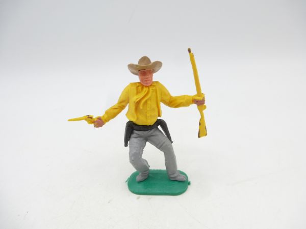 Timpo Toys Cowboy 1. Version, tiefgelb mit Gewehr + Pistole