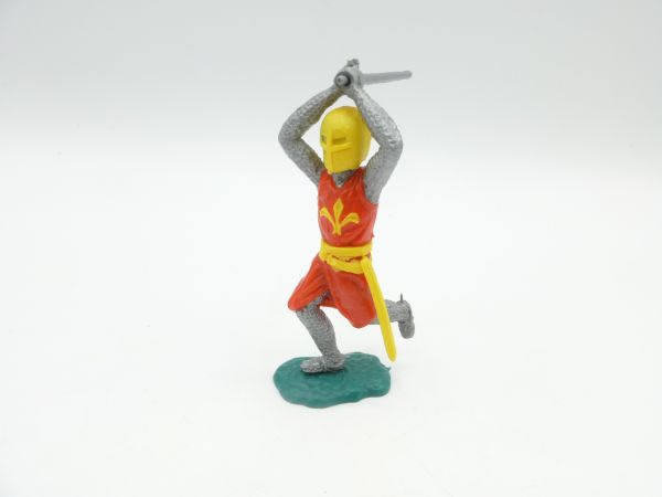 Timpo Toys Medieval knight striking ambidextrously over head (orange/yellow)