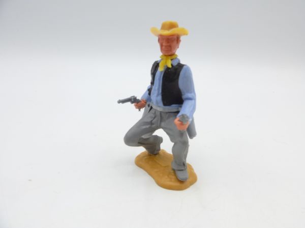 Timpo Toys Cowboy 3. Version hockend mit 2 Pistolen