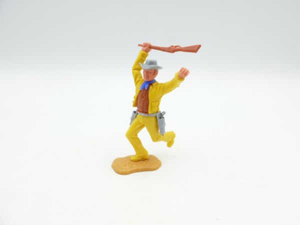 Timpo Toys Cowboy 3. Version (großer Kopf) laufend, Gewehr schlagend