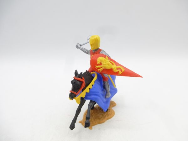 Timpo Toys Medieval knight riding, red/yellow with battle axe