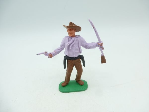 Timpo Toys Cowboy 1. Version, flieder mit Gewehr + Pistole